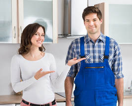 Picture of plumber and customer